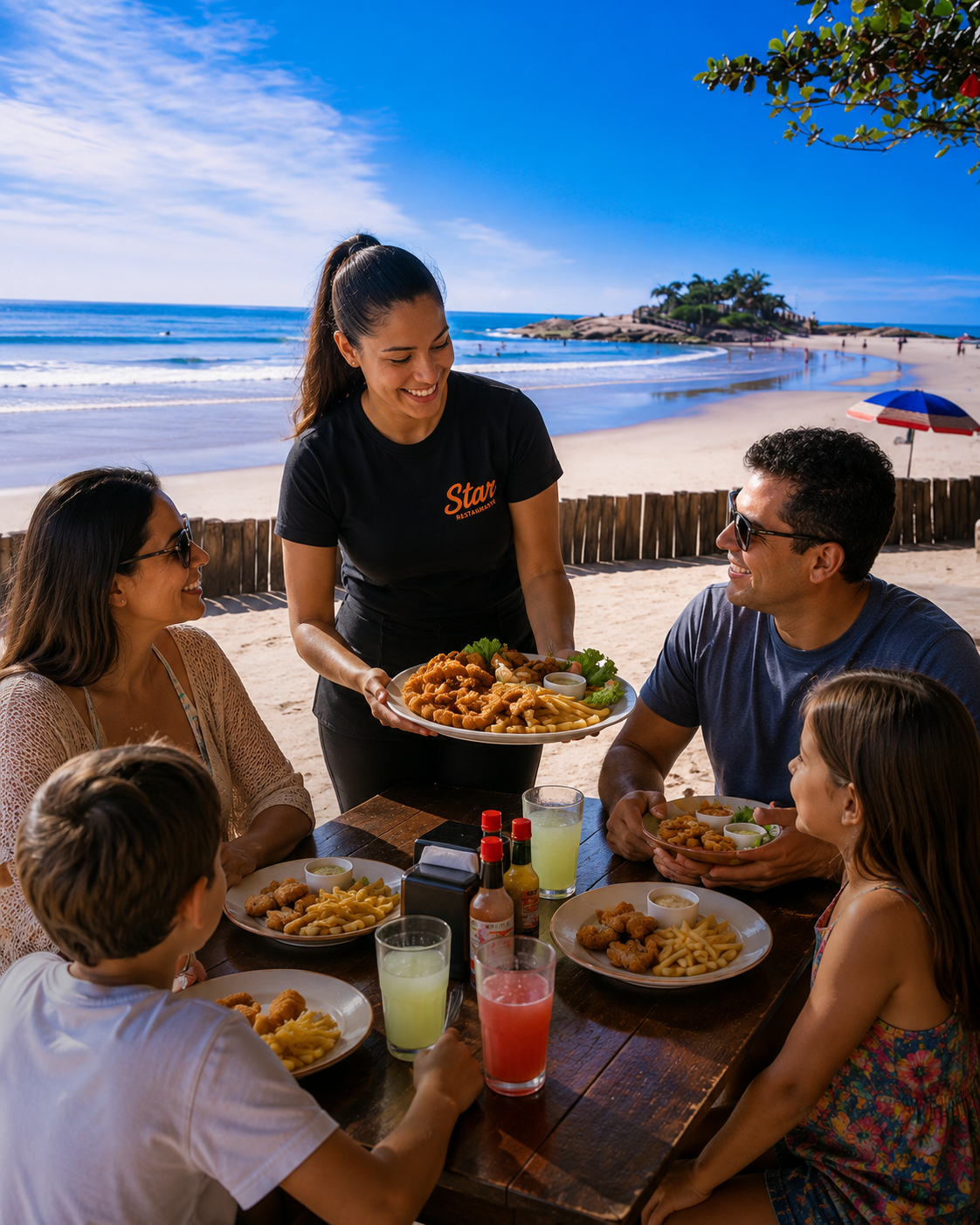 Família sendo atendida em mesa à beira-mar no Star Restaurante em Itapoá